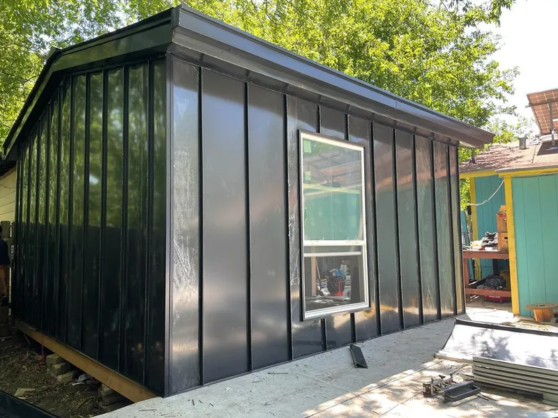 Black standing seam metal wall panels for Roof Inspection in Halawa