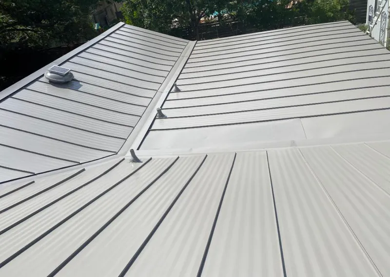 Solar attic fan installed on a metal roof for Roof Ventilation in Halawa